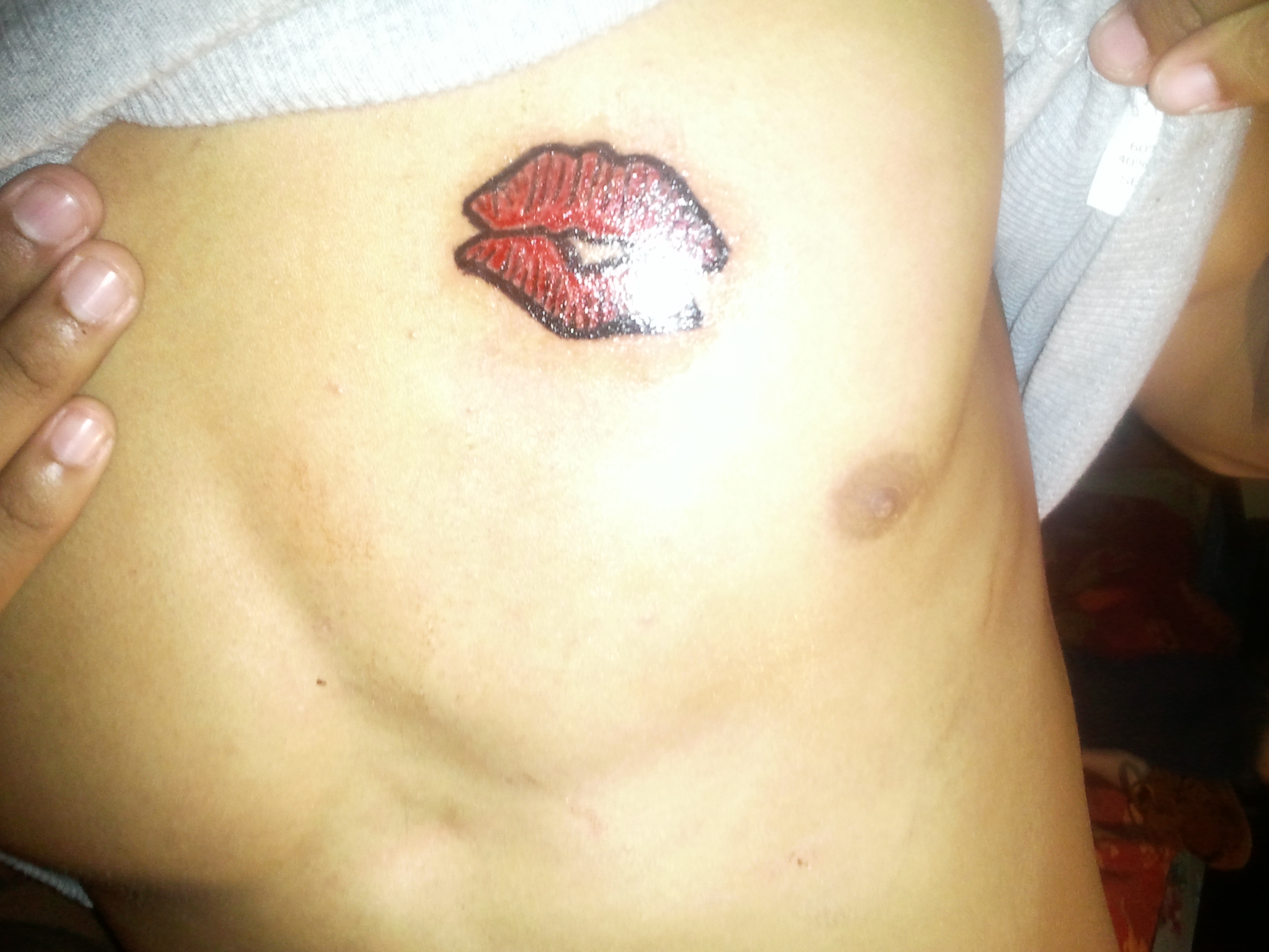 kissing lip tattoos